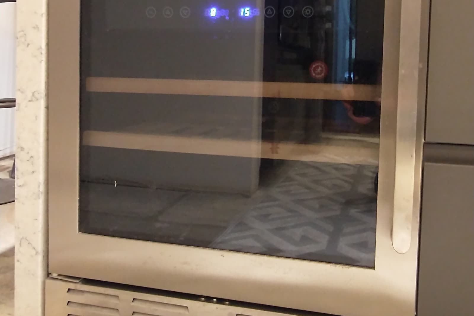Undercounter beverage and wine cooler built into kitchen cabinets