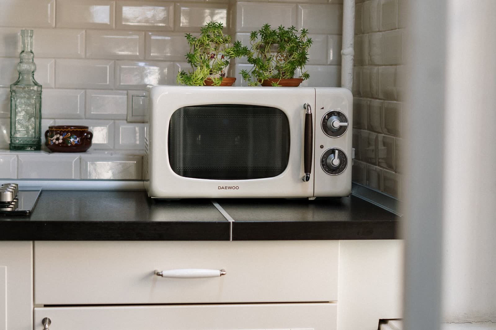 White countertop microwave on a kitchen counter