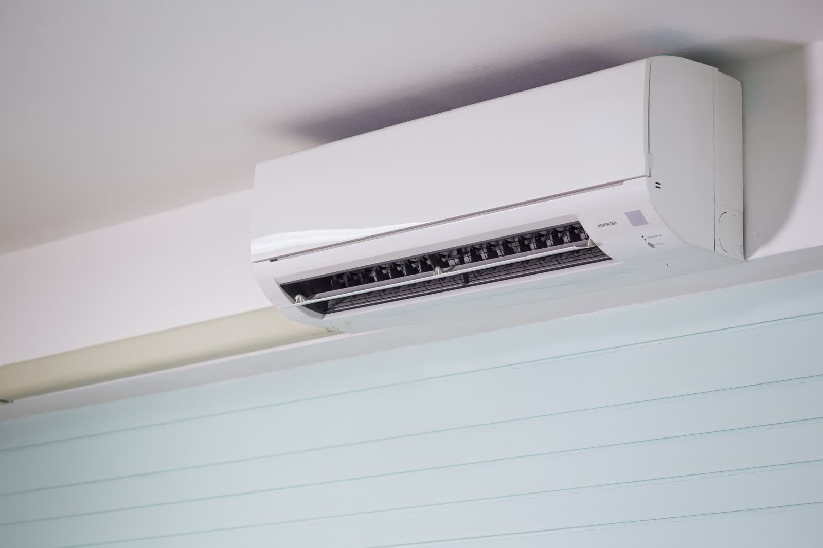 Ductless mini-split indoor head mounted high on a wall