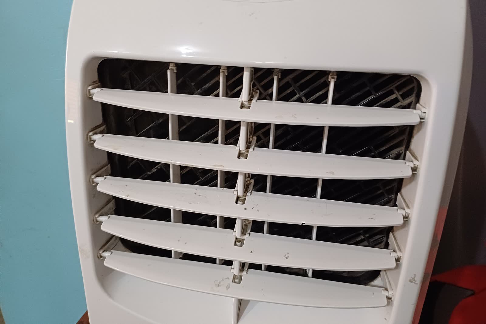 Close view of the louvered air outlet of a portable air conditioner
