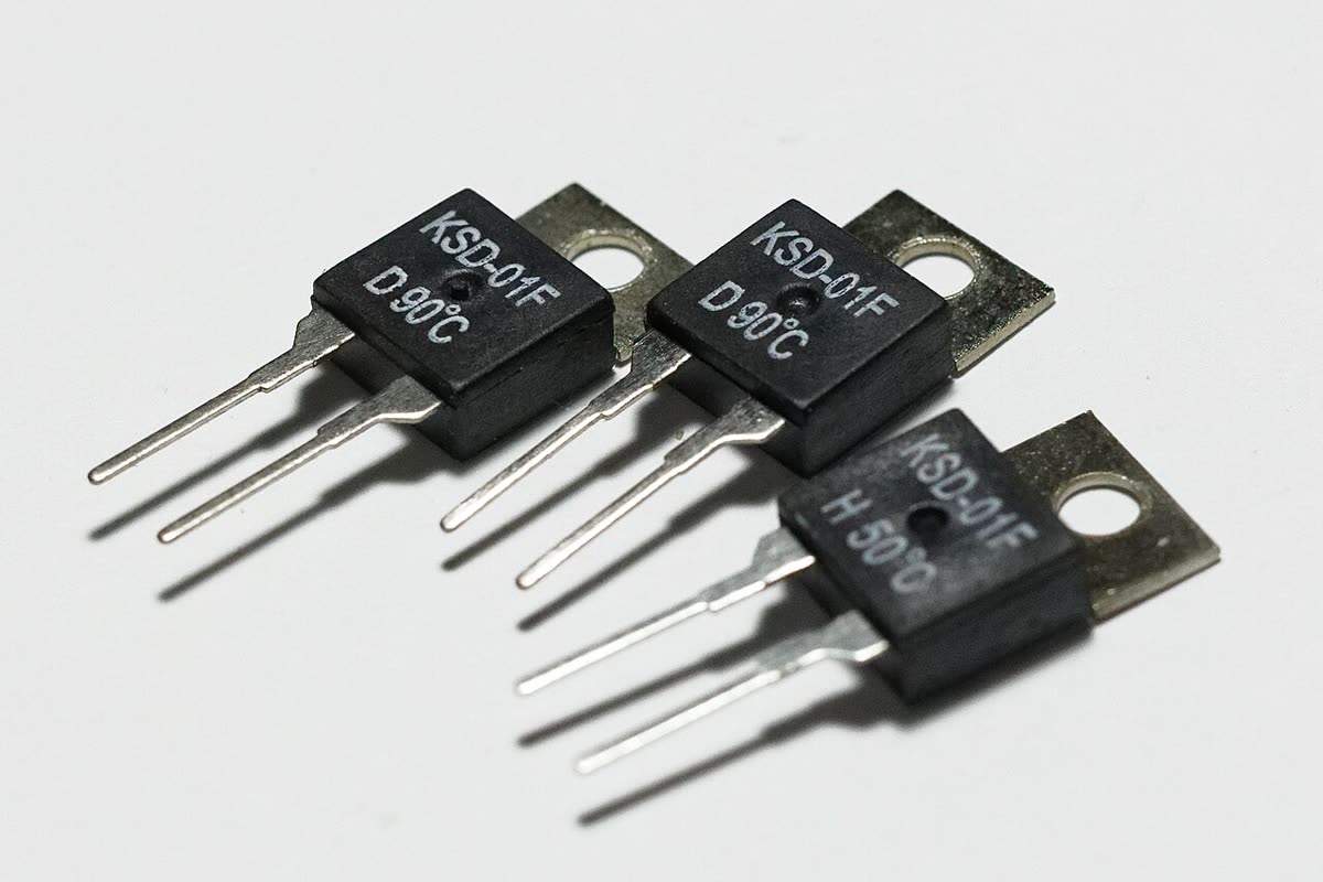 Snap-disc bimetal thermostats with spade terminals, similar to the cycling and high-limit thermostats in dryers and ovens