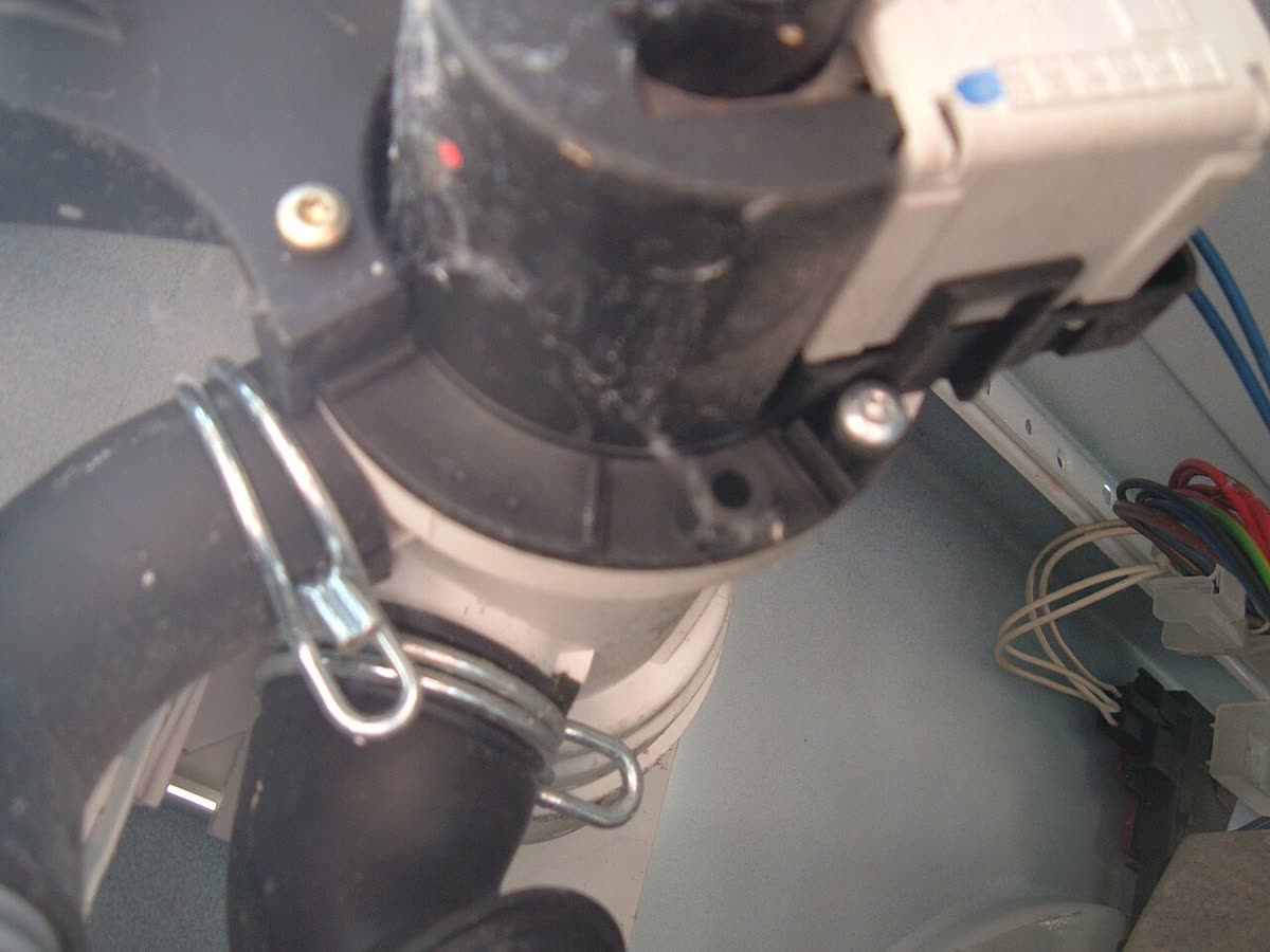 Drain pump removed from a washing machine