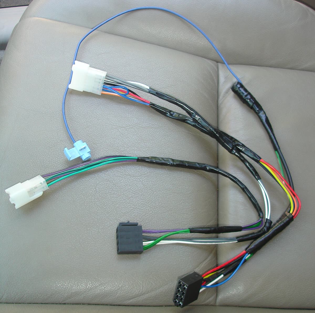 Wiring harness with color-coded wires and plug connectors