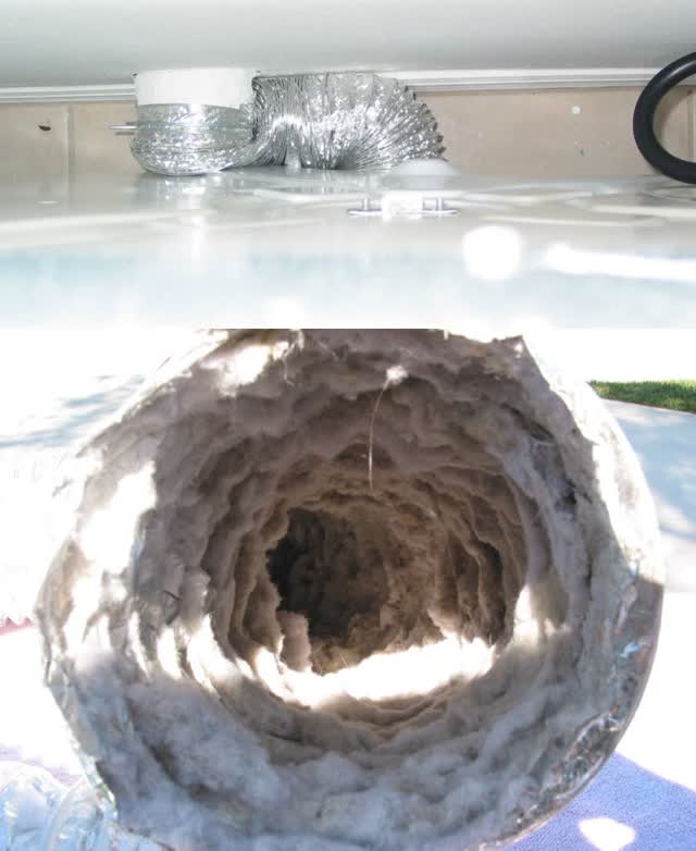 Dryer transition duct packed with lint, a common cause of long dry times and overheating