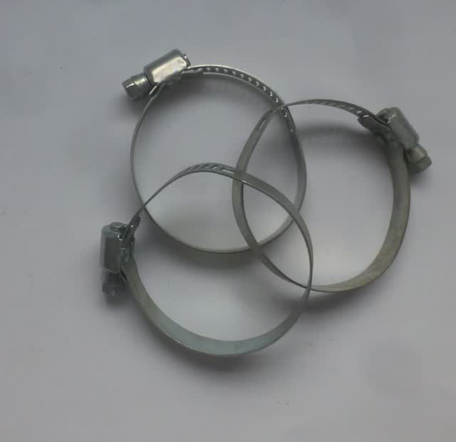 Three worm-drive hose clamps