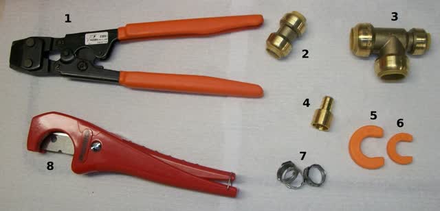 PEX plumbing kit: crimp tool, tubing cutter, brass fittings and crimp rings