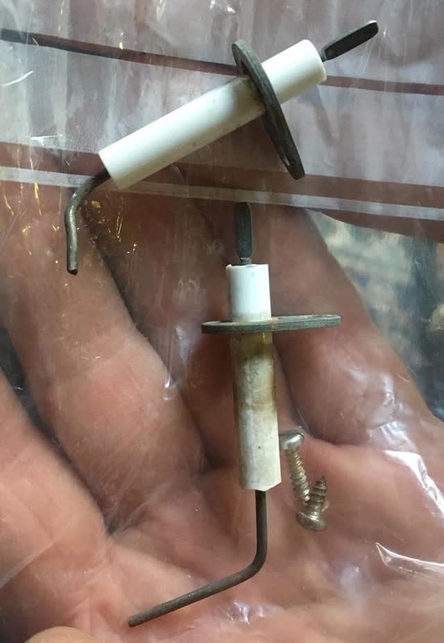 Gas spark igniter electrode (top) and flame sensor rod, each with a white ceramic insulator